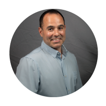 man smiling in grey shirt