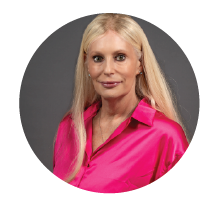 woman smiling in pink shirt