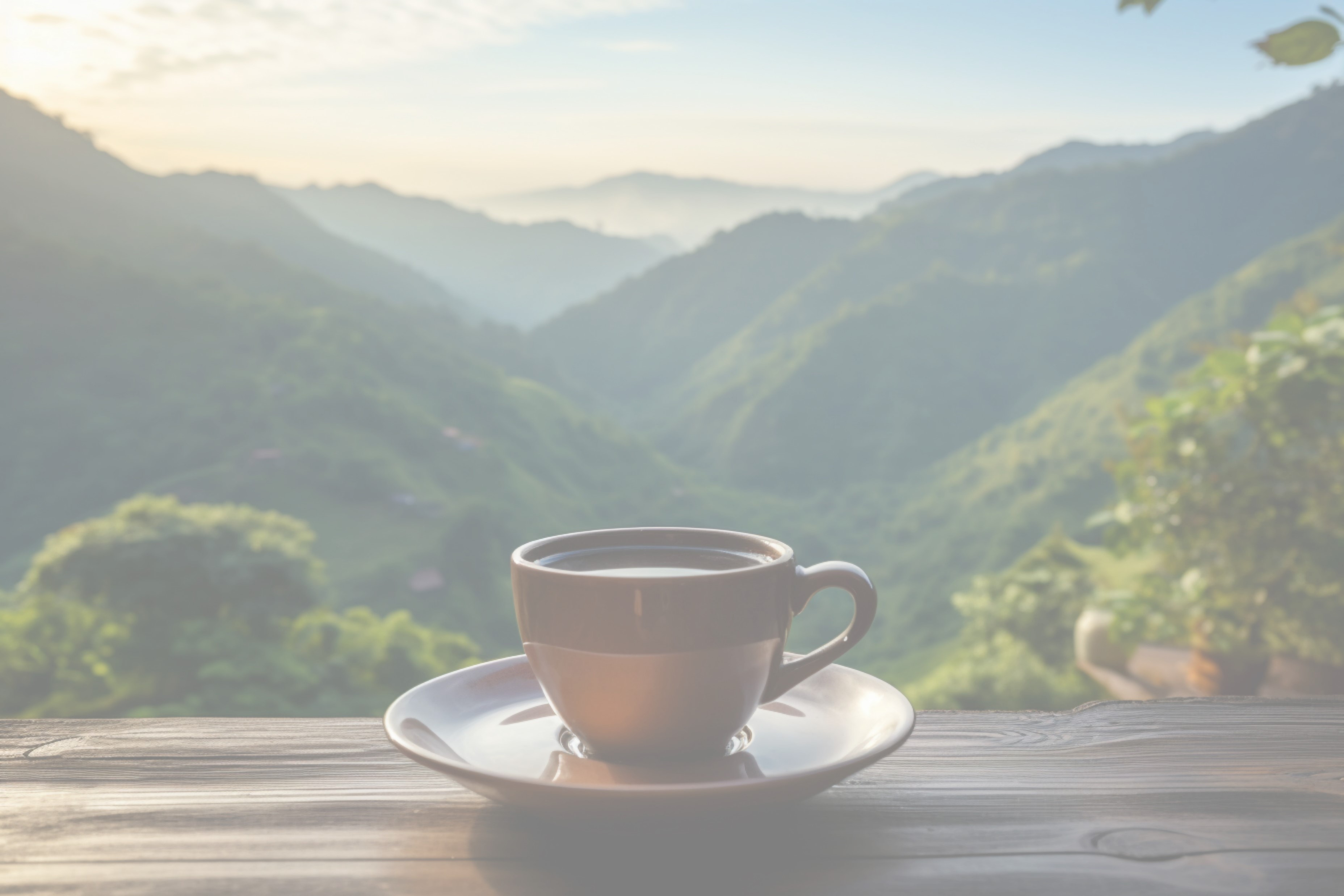 Coffee with a view cup on a wooden table overlooking mountains