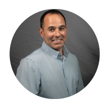 man smiling in grey shirt