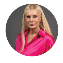 woman smiling in pink shirt